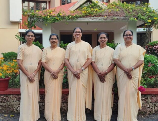 UFES sisters standing together in front of a school building